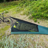 Lightweight DD SuperLight Bikepacker Mesh Tent set up outdoors, offering bug protection for bike travelers.
